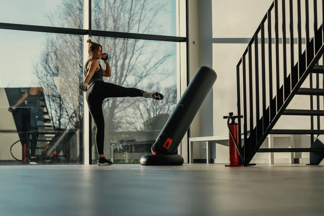Freestanding inflatable punching bag with weightable base
